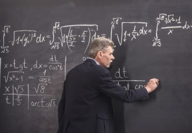 Lecturer in front of blackboard