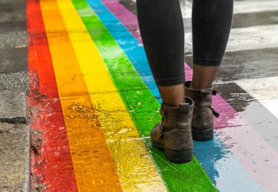 Legs walking on rainbow crossing, LGBT+ inclusion