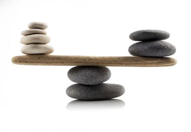 Stones balanced  Stones balanced on a see-saw, symbolising the UK government's levelling up agenda