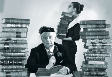 Librarians with piles of books