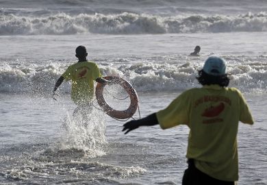 Life guards demonstrate the skill of saving lives at Juhu Beach, Mumbai
