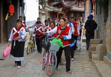 Women in the same clothes on the street in Lijiang, China Women in the same clothes on the street in Lijiang, China, June 2015, illustrating repetition in postgraduate education in China