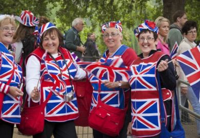 London, England - April 29, 2011 Group of women in fancy dress outfits standing along The Mall in Westminster, join the thousands of well-wishers from around the world to celebrate the Royal Wedding