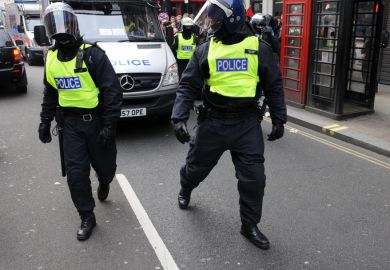 London, UK - March 26, 2011 Police in riot gear advance through central London during a large anti-cuts rally on March 26, 2011 in London, UK.