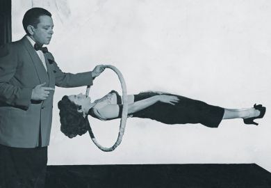 Magician performing gravity-defying trick