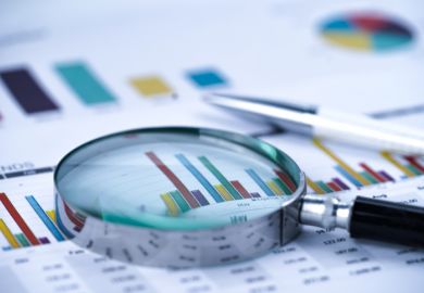 a magnifying glass on charts