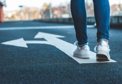 Walking on directional sign on asphalt road Make decision which way to go, walking on directional sign on asphalt road