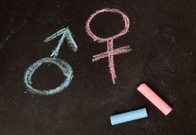 Male/female gender symbols drawn in chalk