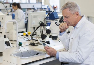 Male scientist using tablet computer in laboratory