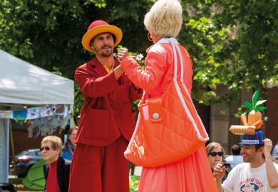 Man and woman dancing wearing stilts Man and woman dancing wearing stilts
