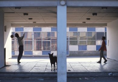 Man and young boy shooting soccer penalties, Glasgow, Scotland