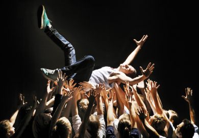 Man being carried by group