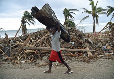 Man carrying corrugated tin
