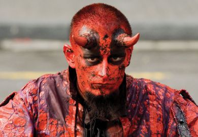 Man dressed as the devil/satan Man dressed as the devil/satan
