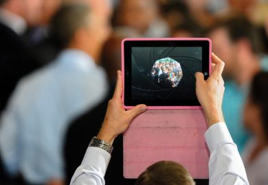 Man filming video using Apple iPad Man filming video using Apple iPad