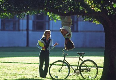 Man hanging upside-down from tree Man hanging upside-down from tree