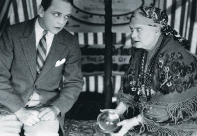 Man has his fortune told with a crystal ball