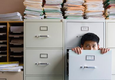 Man in a filing cabinet