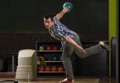 Man in dramatic bowling pose