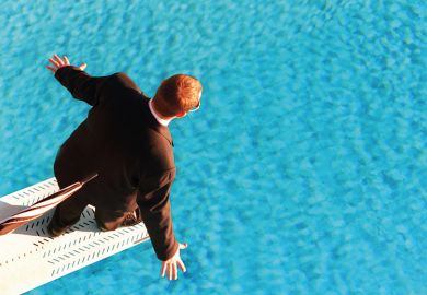 Man in suit on diving board