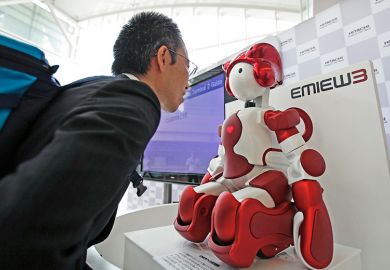 Man looking at robot