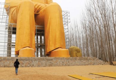 Man looking at statue of Mao Zedong, China, 2016 Man looking at statue of Mao Zedong, China, 2016