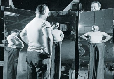 Man looking in funhouse mirror