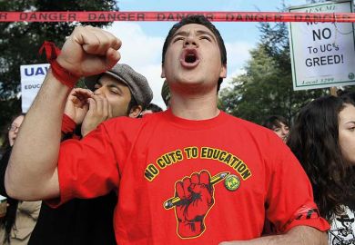 Man protesting cuts to education
