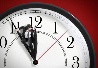 Man pushing against clock hands