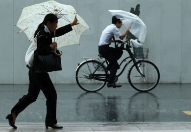 Man rides a bicycle ahead of woman walking Man rides a bicycle ahead of woman walking
