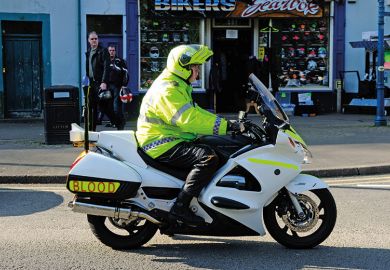 Man riding medical blood motorbike