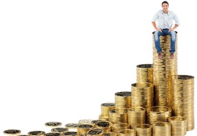 Man sitting on pile of money