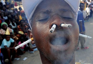 Man smoking cigarettes with ears and nostrils