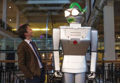 Man looking up at giant robot