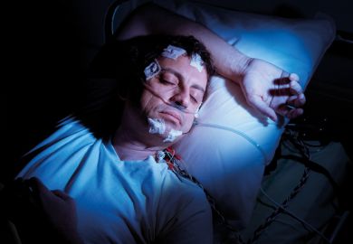 Man undergoing polysomnographic examination Man undergoing polysomnographic examination