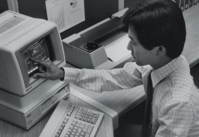 Man using Hewlett Packard HP-150 touchscreen computer