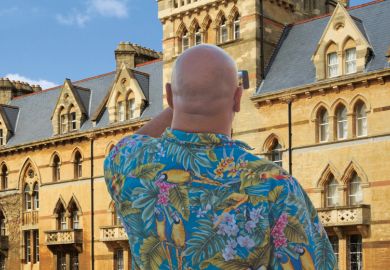 Man using smartphone to photograph Meadow Building, Christ Church College, University of Oxford