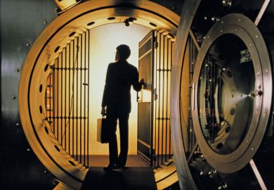 Man walking into bank vault