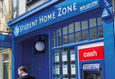 Man walking past Student Home Zone office Man walking past Student Home Zone office