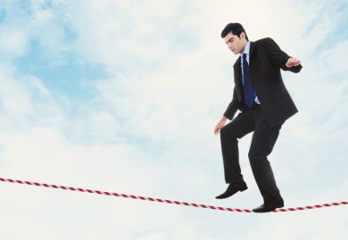 Man walking on tightrope