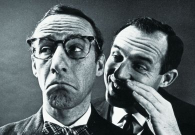 Man whispering in other man's ear