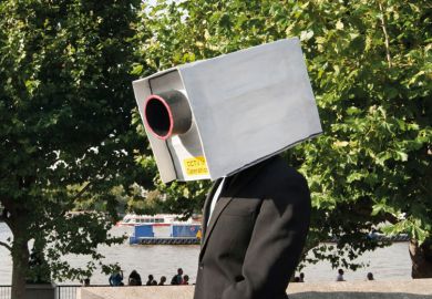 A man with a CCTV camera on his head A man with a CCTV camera on his head