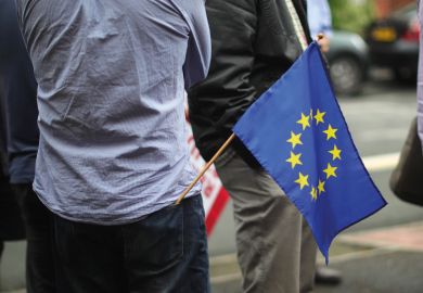 Man with European Union (EU) flag in back pocket