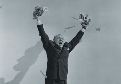 Man celebrating with hands full of cash Man celebrating with hands full of cash