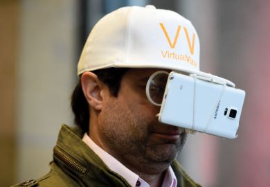 Man with smartphone strapped to baseball cap Man with smartphone strapped to baseball cap