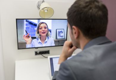 Man and woman videoconferencing