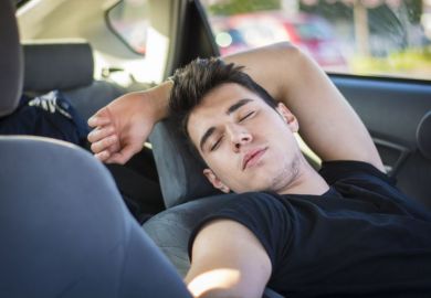 Man sleeping in a car Man sleeping in a car