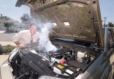 Man with overheating car Man with overheating car