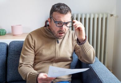 man worried about bills reading energy increase costs