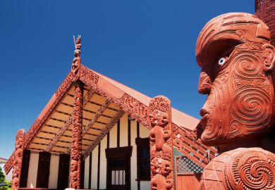 Maori wood carving outside of Te Papaiouru Marae, a Maori meeting house in the tourist town of Rotorua, New Zealand